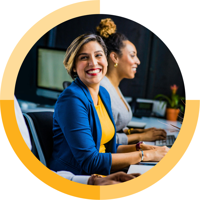 happy women using computers in office with circle frame and yellow outline