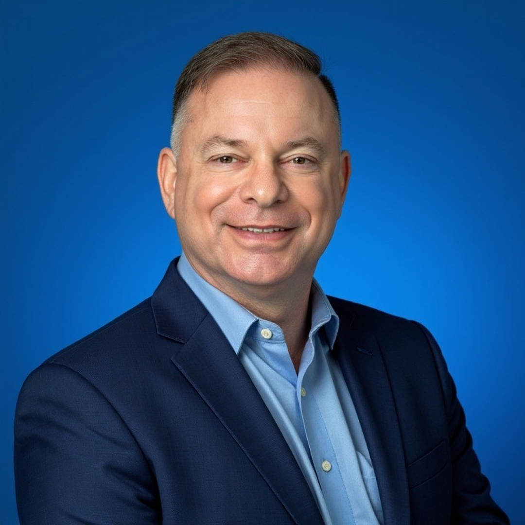 professional shot of Scott in front of background